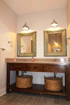 Located on 1st floor, master bathroom with double sinks and beautiful tile showe