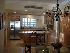 Dining area & Fully Equipped Kitchen including microwave, dishwasher, stove