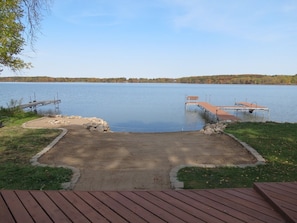 View from the deck. Fire pit is off to the left. Sandy beach w/ dock.