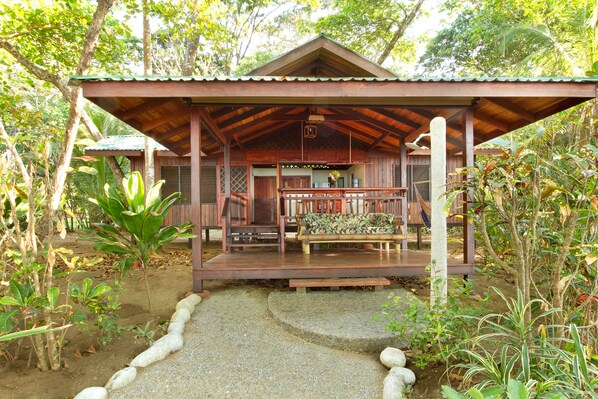 Main house, with outdoor shower and a pathway directly to the beach.