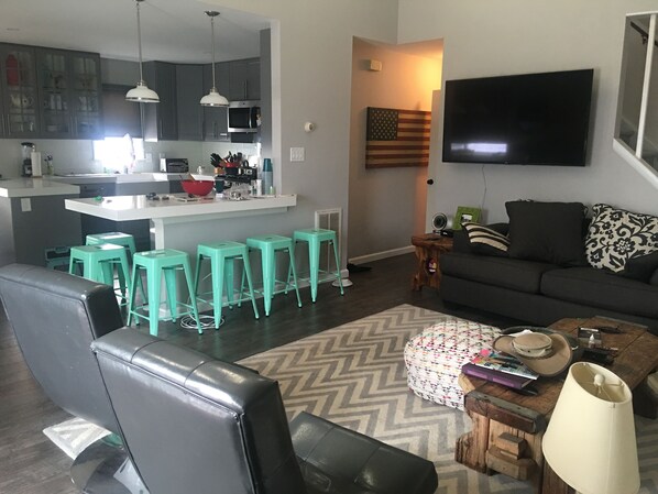 Spacious open living with remodeled kitchen and quartz island