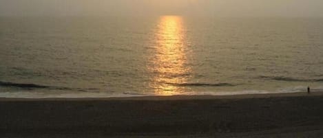 Balcony view of sunrise over ocean