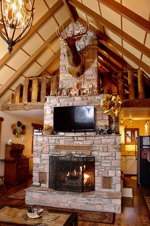 Beautiful stone gas fireplace.