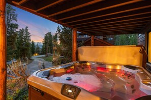 Hot tub sits below the deck on the 1st floor.  Perfect for apres ski or hikes!