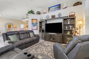 Open concept home with stunning 90 degree zero corner glass sliding doors, blending the interior and exterior living spaces seemlessly.