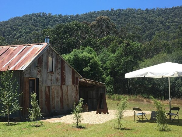 Undercover parking, an outdoor area for picnics and a fire place.