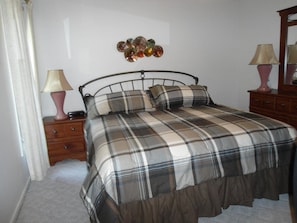 Master bedroom, king size bed with private bathroom.