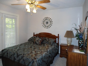 Bedroom 2, queen bed, patio does to the deck.