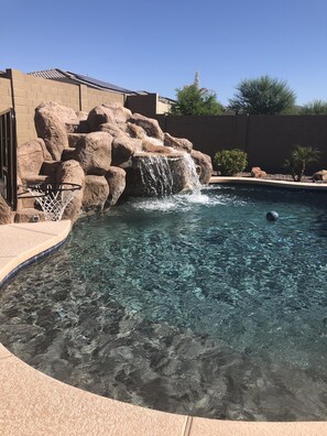 Water feature includes...water slide and cascading waterfall.  