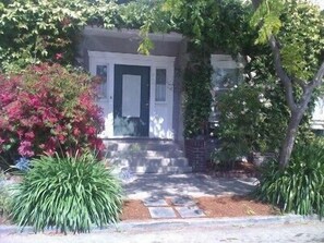 Facade of 1908 Edwardian property located in a quiet, tree-lined cul-de-sac.