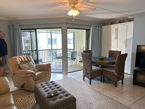 Comfortable dining area next to living room.