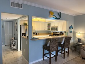 Convenient full kitchen with stainless steel appliances.