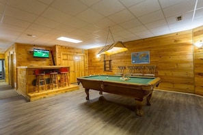 Enjoy the spacious rec space with pool table, wet bar, and flat screen TV