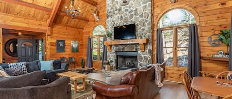 Updated log cabin, with 8 bedrooms, spacious living spaces, and upgraded & comfortable features.