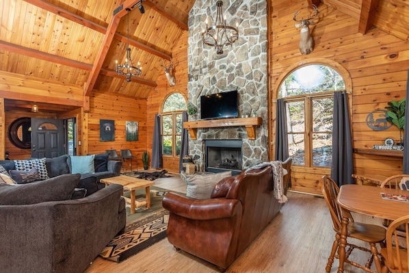 Updated log cabin, with 8 bedrooms, spacious living spaces, and upgraded & comfortable features.