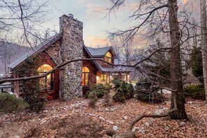 Welcome to Grand Pine Lodge, the quintessential Log cabin with gas stone fireplace, abundance of space and luxurious features