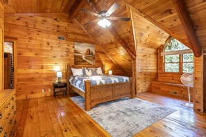 Vaulted ceiling master with floor to ceiling yellow pine.