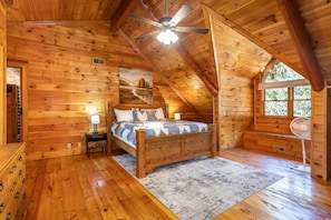 Vaulted ceiling master with floor to ceiling yellow pine.