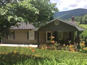 Front of home with June day lilies