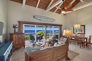 LIVING ROOM WITH OCEAN IN BACKGROUND