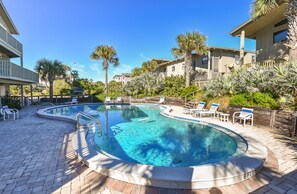 Pool with landscaping and pool chairs