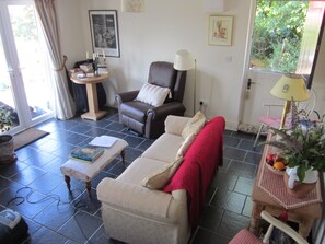 Sitting room with half door and French doors looking out on Connemara
