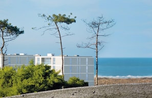 Closed condo with pool, facing the beach and countryside. 