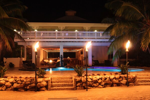 View of house from water at evening
