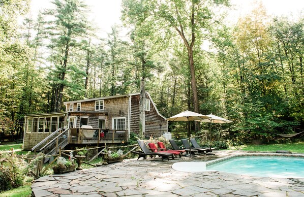 Looking at rear of house from pool area