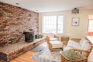 Sitting area off of kitchen with wood stove (firewood provided!)