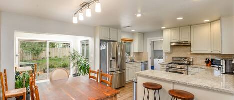 Kitchen dining room and sunroom.