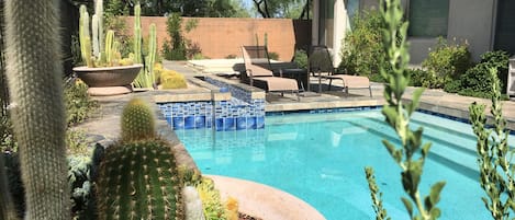 Quiet private pool with mature landscaping, sitting area and spa