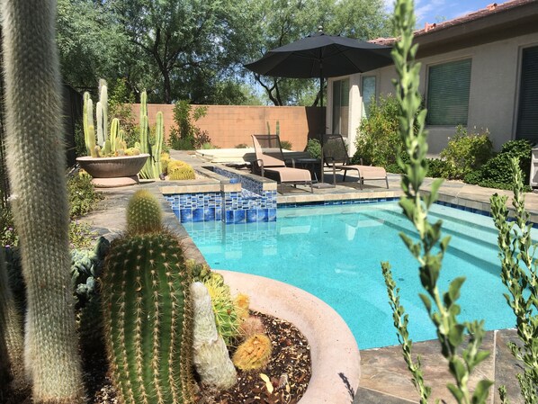 Quiet private pool with mature landscaping, sitting area and spa