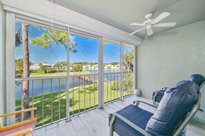BEL201 - The screened in lanai offers a beautiful lake view