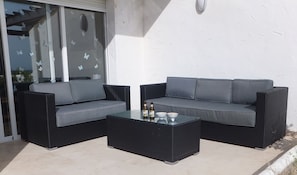 relax and soak up the sun on the patio sofas