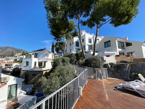 It is the detached house on the left