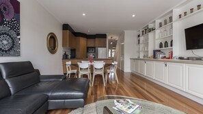 Open plan living area with dining room and kitchen