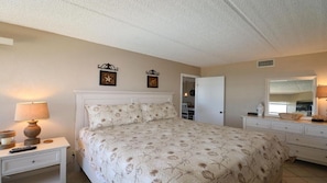 Master bedroom with ocean waves to lull you to sleep & ocean sunrise from bed!