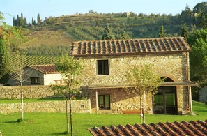 'Capanna' with garden, the trees are bigger now, in front the wine cellar roof