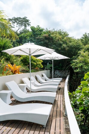 Private beach terrace just steps from the villa.