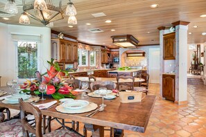 Two dinning areas , table and kitchen counter