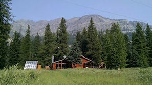 Front view of the cabin and greenhouse