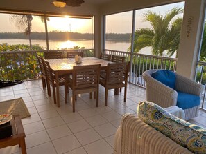 Screened in patio/balcony. Table seats 8