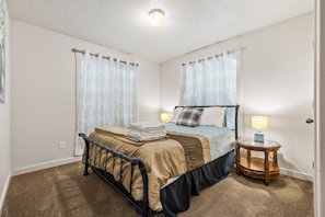 Get some much needed rest in this second bedroom with a cozy queen bed!