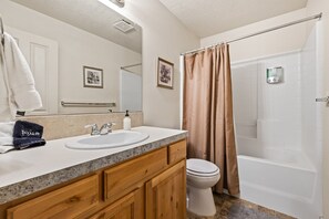 This bathroom off the Primary bedroom is spacious and sparkling clean!