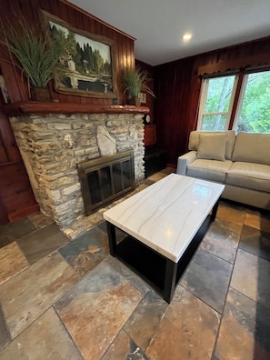 Living room with beautiful stone fireplace