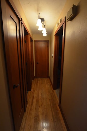 Hallway leading to Master, 2nd bedroom, 2 baths. Includes linen closet & pantry.