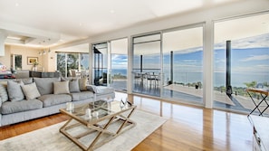 Cozy living room with sofa and breathtaking ocean view