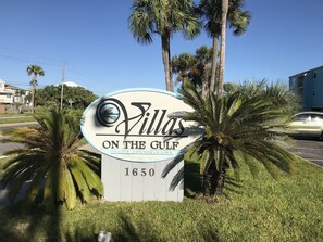 Front entrance from the main artery road on the beach Via De Luna Dr. 