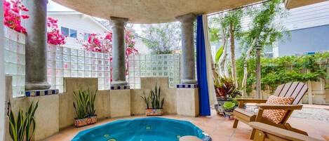 Private in-ground spa retreat patio with pull curtains.  Great place to unwind.